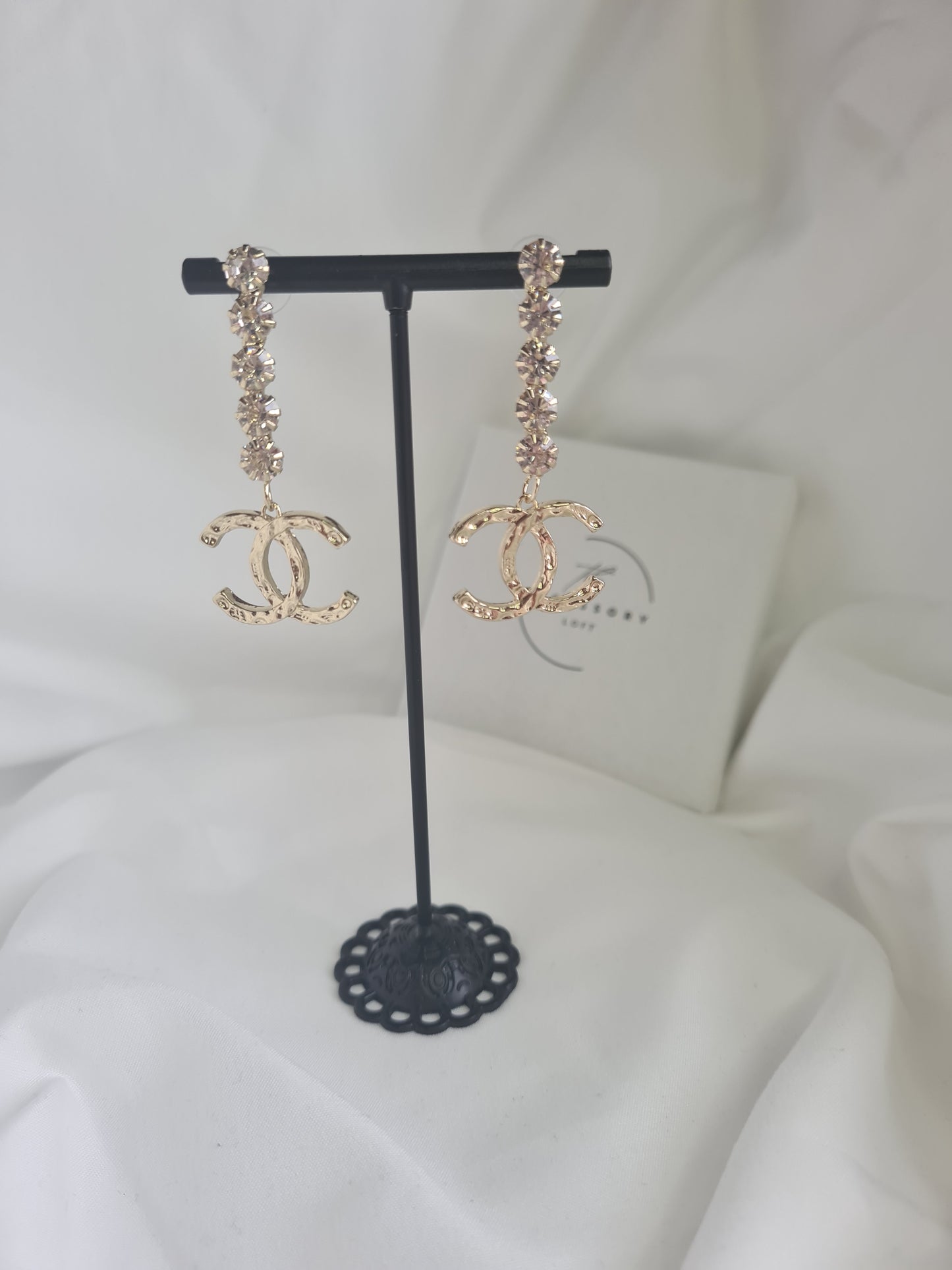 Joan diamante drop letter earrings.