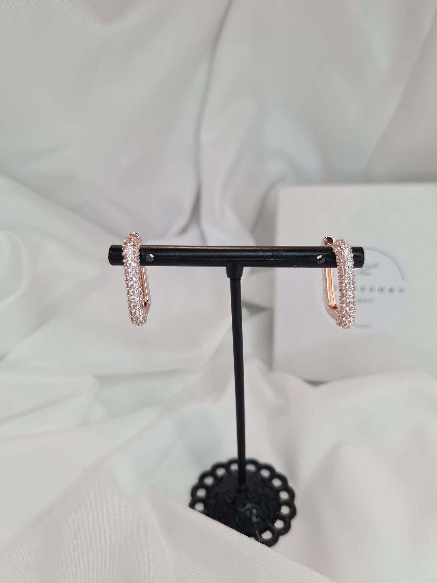 Una diamanté huggie hoop earrings