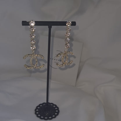 Joan diamante drop letter earrings.